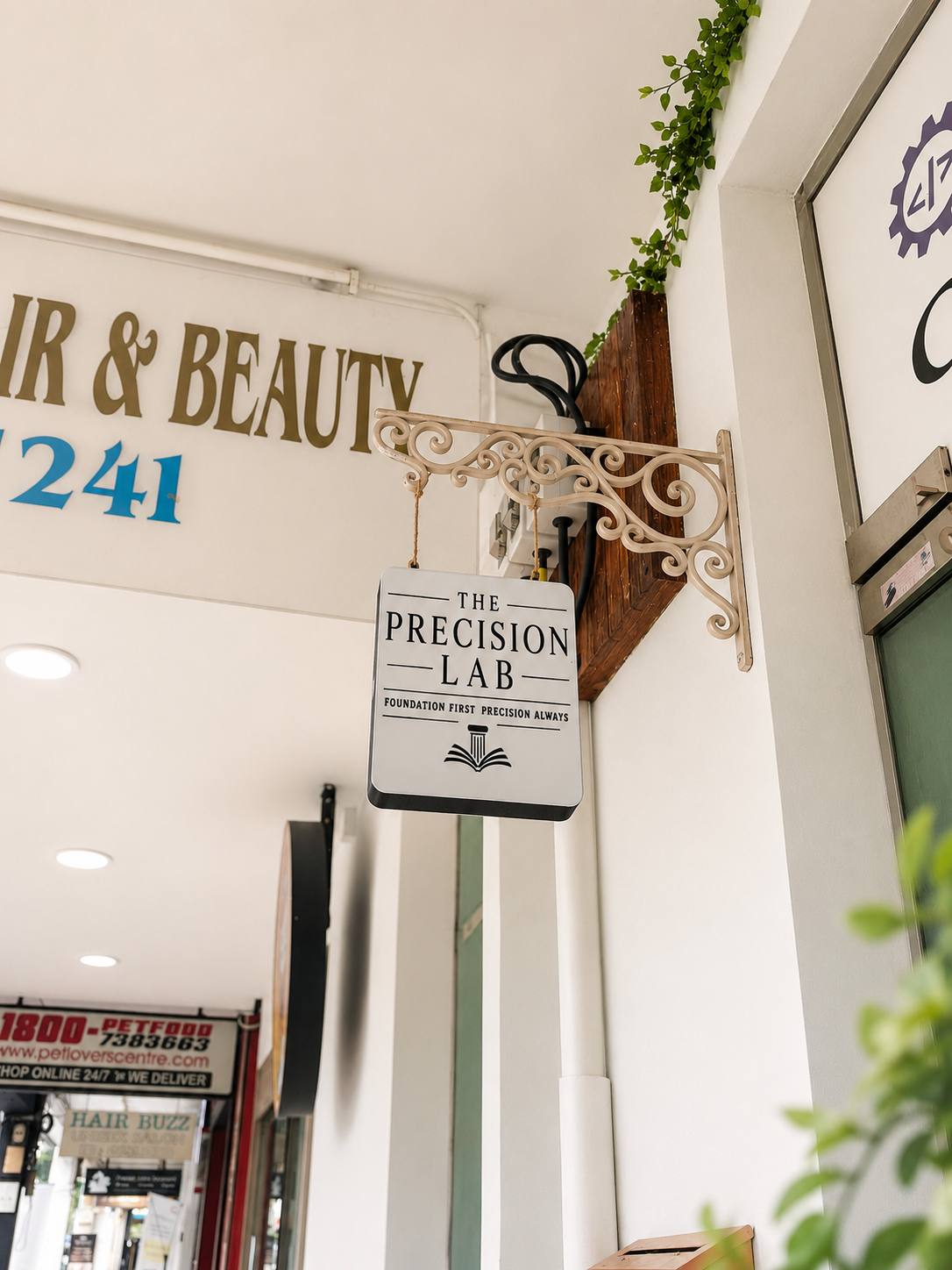 The Precision Lab shopfront hanging sign